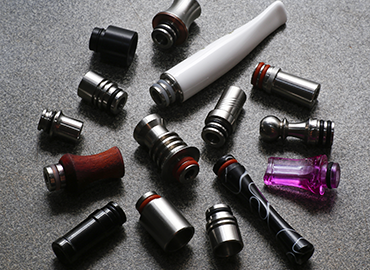 Ergonomic resin wide bore drip tips